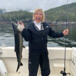 Guest fishing on a pristine Alaskan waters with Eagle Wings Wilderness Lodge
