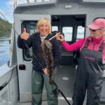 Guests fishing on a pristine Alaskan waters with guide from Eagle Wings Wilderness Lodge